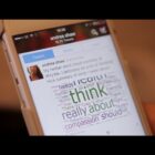 Andrea Shaw's Twitter account showing on a phone screen