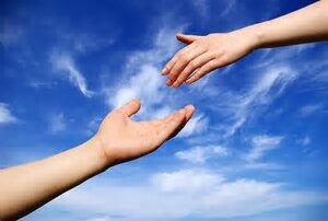 hand reaching out for hand