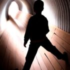 A boy in a tunnel