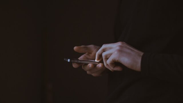 someone using a mobile phone