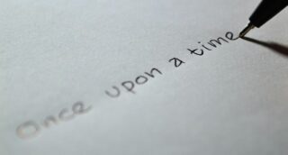 Someone writing 'once upon a time'
