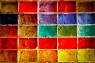 box of different coloured paints