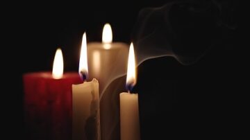 candles burning in the darkness