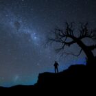 Silhouette against a dark starry sky