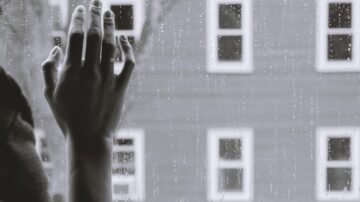 person looking out of the window