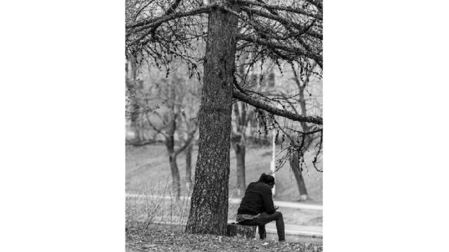 Man sitting alone in a park