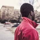 Black man turned away from camera