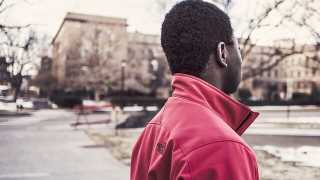Black man turned away from camera