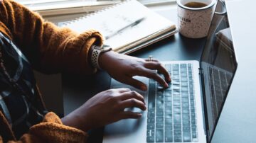 woman typing on laptop