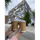 2 coffee cups held up