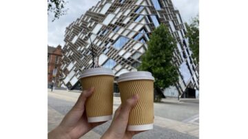 2 coffee cups held up