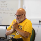 Neil sitting in a chair