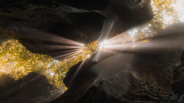 Light shining through cracks in rocks