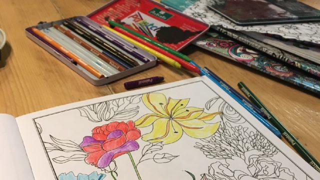 colouring book and colouring pencils