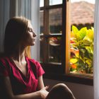 woman sat by a window