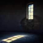 light shining through the window into a dark room