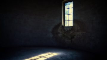 light shining through the window into a dark room