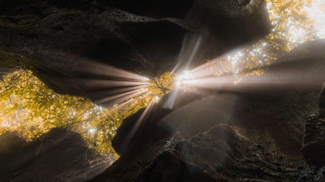 Light shining through cracks in rocks